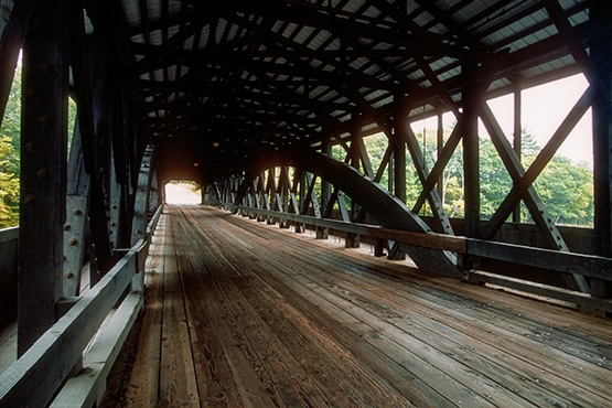inside a wooden covered bridge