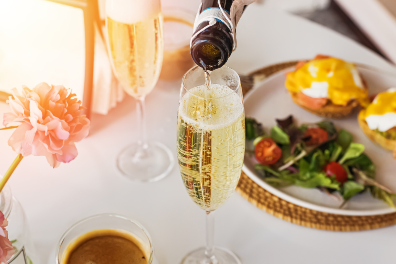 brunch plate and sparkling drink on table