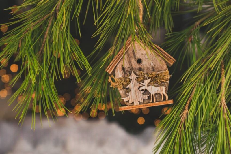 wood-burning ornament hanging on a christmas tree