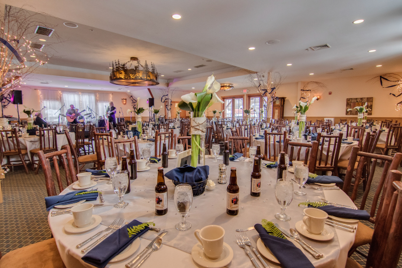 view of wedding tablescapes with beer bottles at the woodstock inn brewery