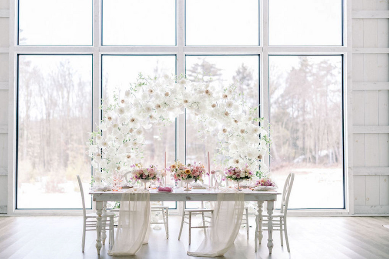 wedding table against a floor-to-ceiling window